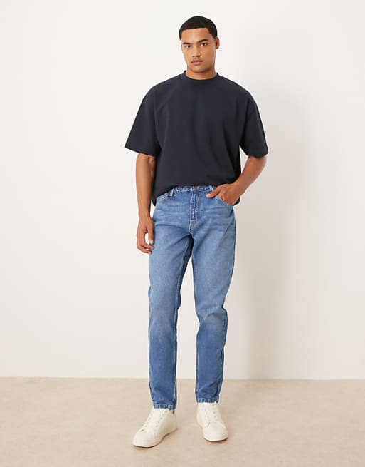 ASOS DESIGN tapered jeans in mid wash