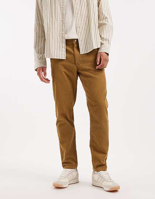 ASOS DESIGN tapered trousers in brown corduroy