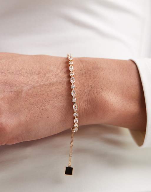 ASOS DESIGN tennis bracelet with cubic zirconia stone details in gold tone in gift bag