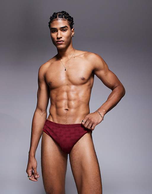 ASOS DESIGN textured swim brief in burgundy