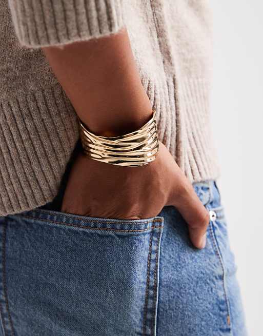 ASOS DESIGN wide cuff bangle with ridged texture in gold tone