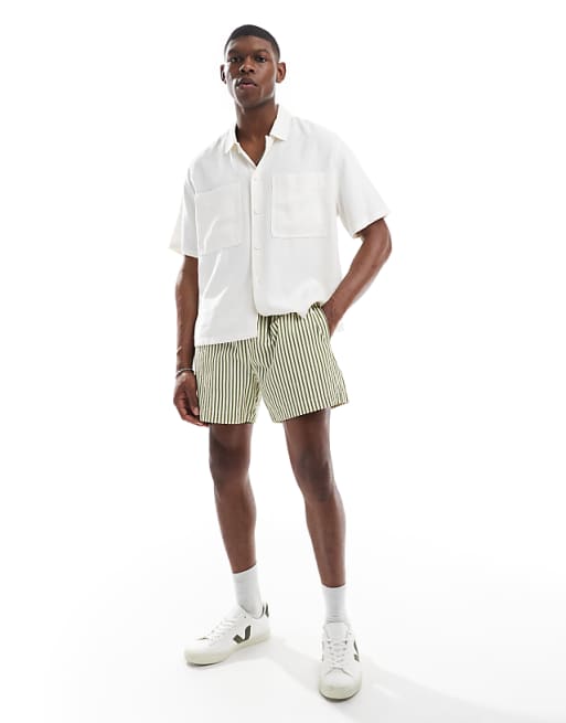 ASOS DESIGN wide shorter length short in green and white stripe