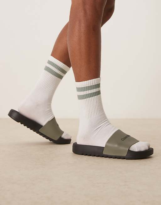 Calvin Klein Jeans logo sliders in olive and black