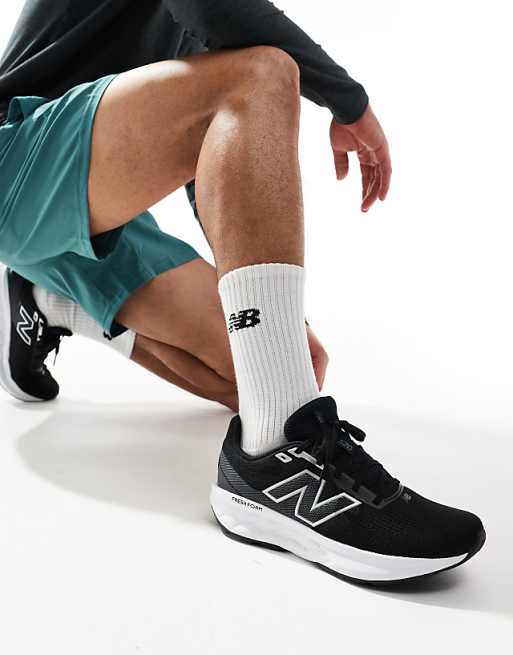 New Balance 520 running trainers in black and white