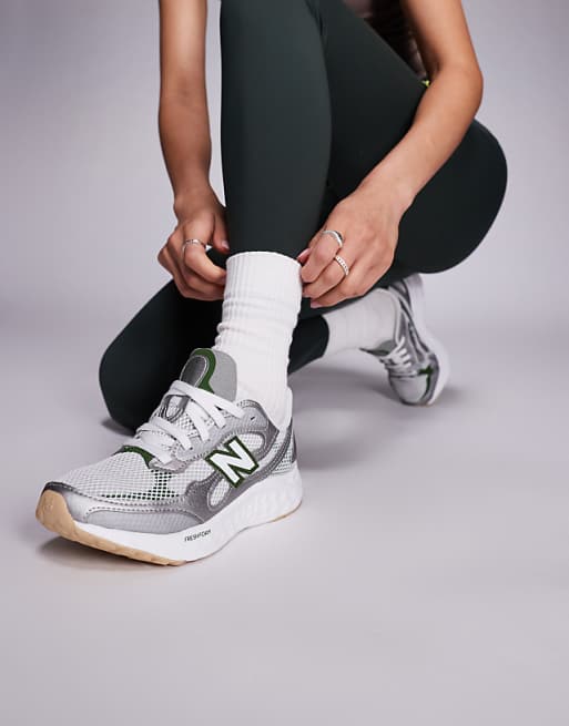 New Balance Arishi running trainers in silver and green