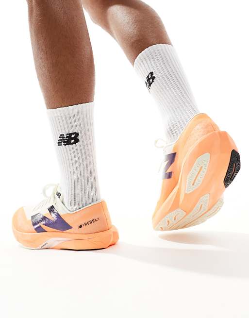 New Balance Fuelcell Rebel V4 Mens Running Trainers In Orange