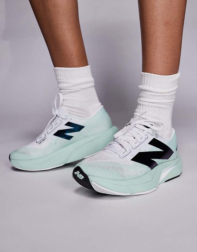 New Balance FuelCell Rebel V4 womens running trainers in white and green