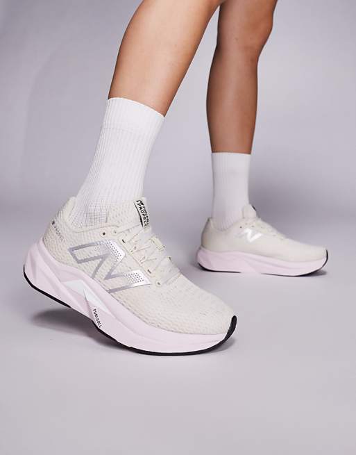 New Balance Propel running trainers in beige and pink