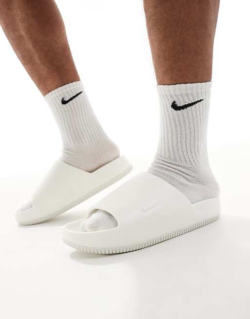 Nike Calm sliders in white