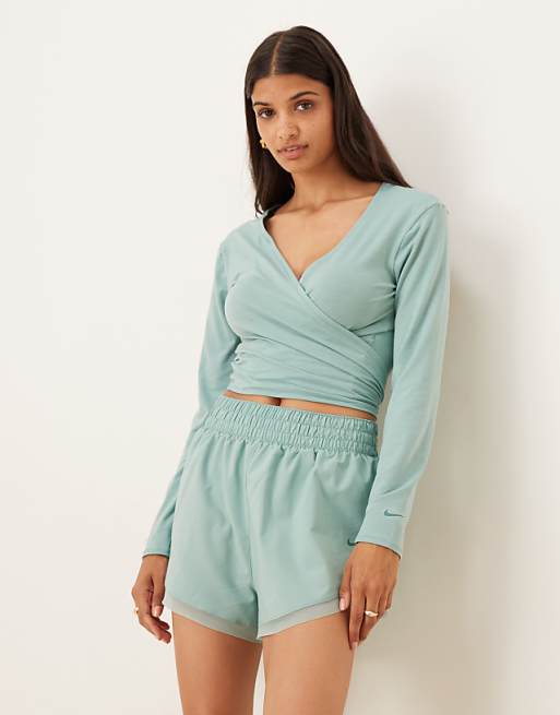 Nike One Training Relaxed Wrap Longsleeve Top Layered Vest And High Waisted 3 Inch Frilly Shorts In Light Blue