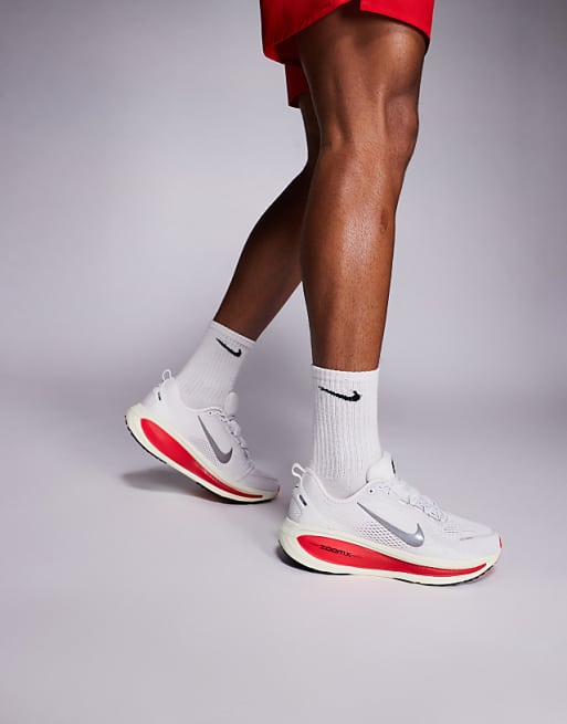 Nike Running Vomero 18 trainers in white and red