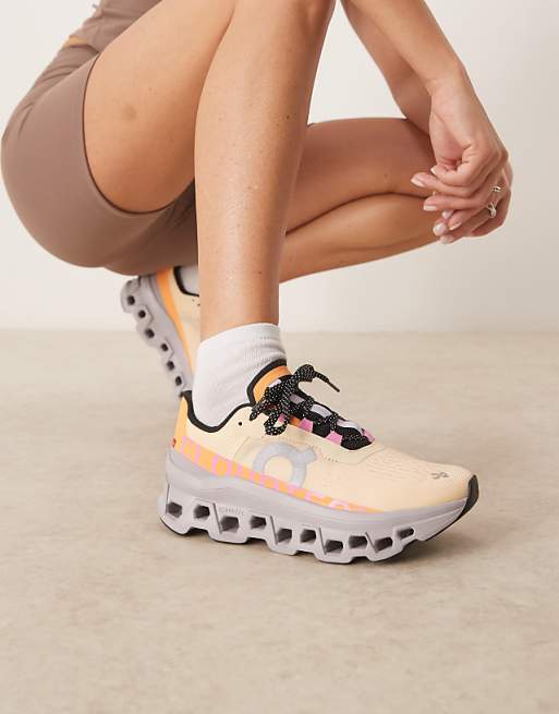 ON Cloudmonster running trainers in coral