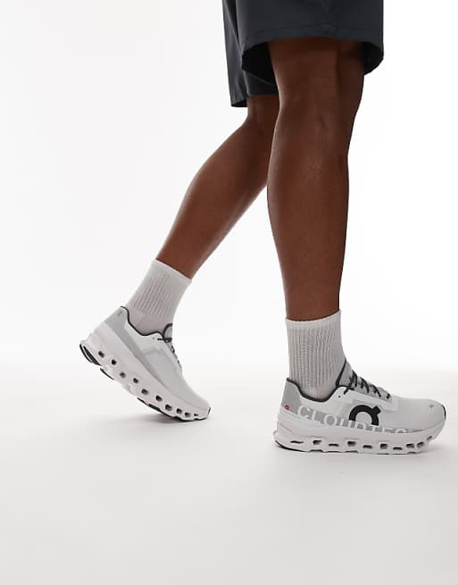 ON Cloudmonster running trainers in white