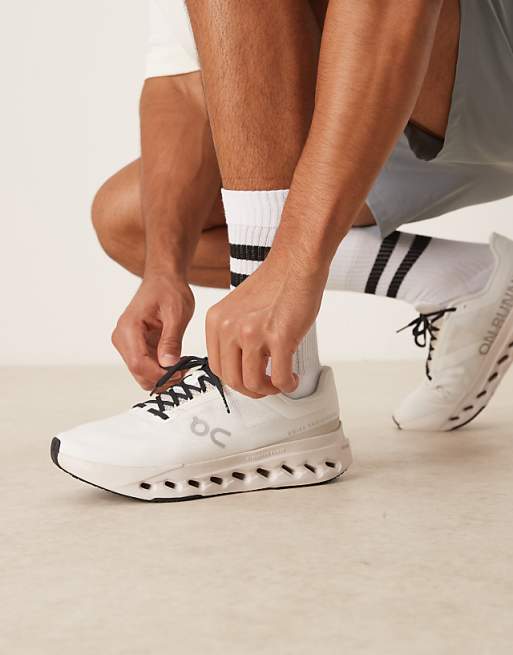 ON Cloudsurfer Next running trainers in ivory and silver