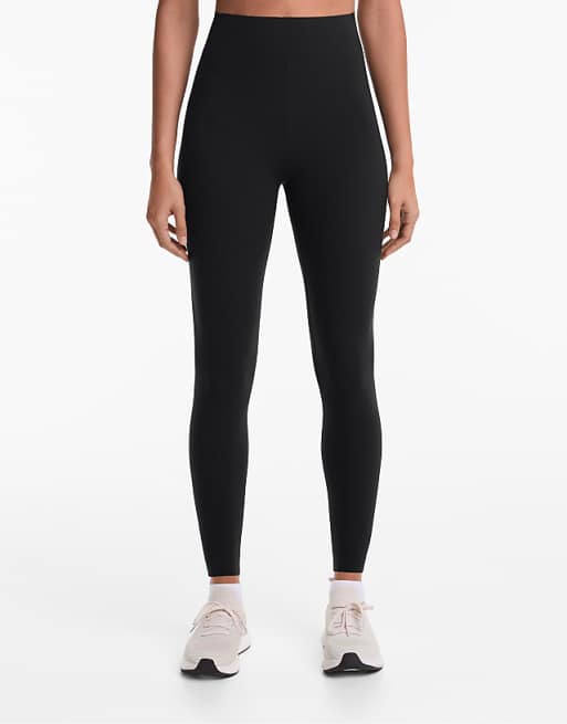 OYSHO Compressive core control ankle-length leggings in black
