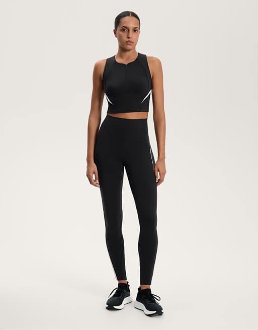 OYSHO Compressive high rise ankle-length leggings with side stripes 65cm in black