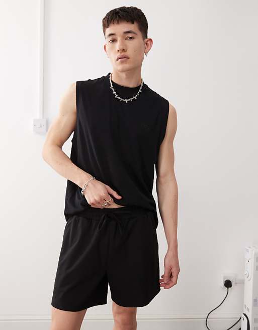 Reclaimed Vintage shorter length jersey shorts in black