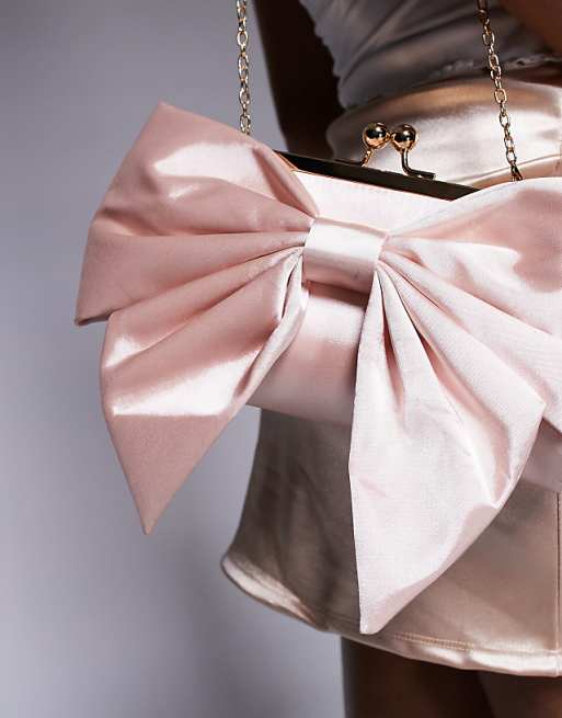 True Decadence Bow Front Clutch Bag In Pink
