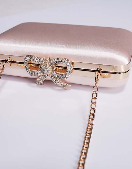 True Decadence Satin Clutch Bag With Bow Clasp In Blush Pink