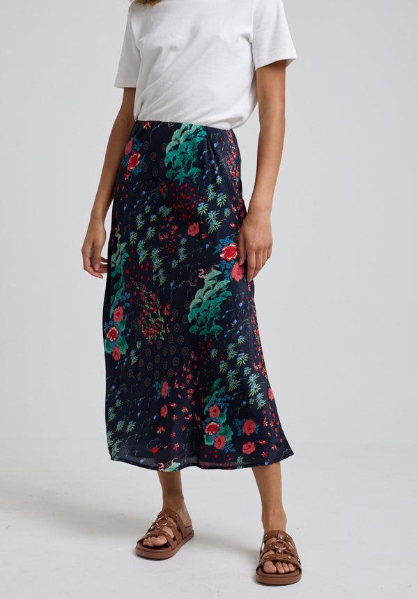 Lily And Lionel Ivy Bias Cut Wonderland Print Midi Skirt In Black