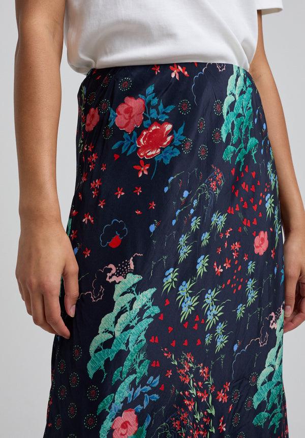 Lily And Lionel Ivy Bias Cut Wonderland Print Midi Skirt In Black