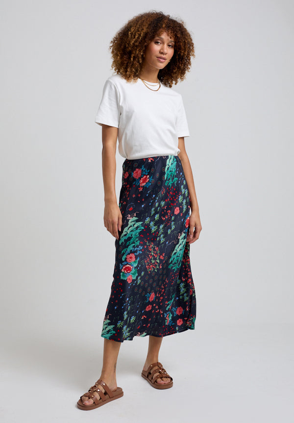 lily and lionel Ivy Bias Cut Wonderland Print Midi Skirt In Black