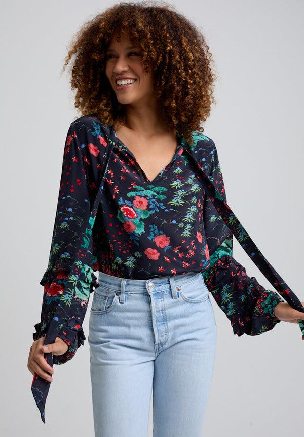 Lily And Lionel Rina Ruffle Sleeve Wonderland Print Blouse In Black