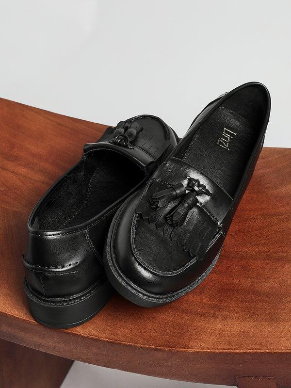 linzi Black Faux Leather Classic Slip On Loafer With Fringing