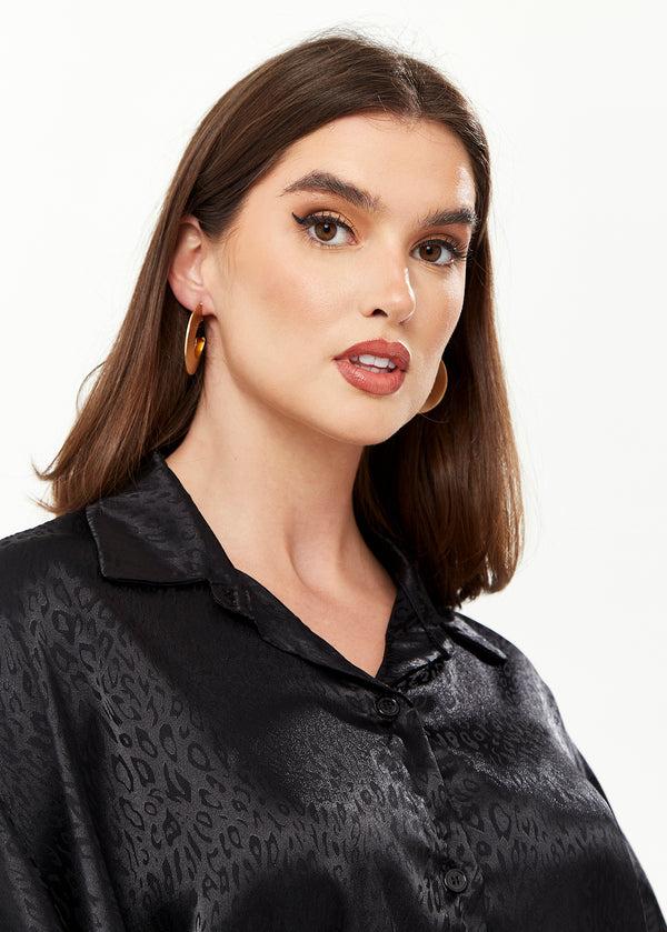 Liquorish Divine Grace Flattened Hoop Earrings In Gold