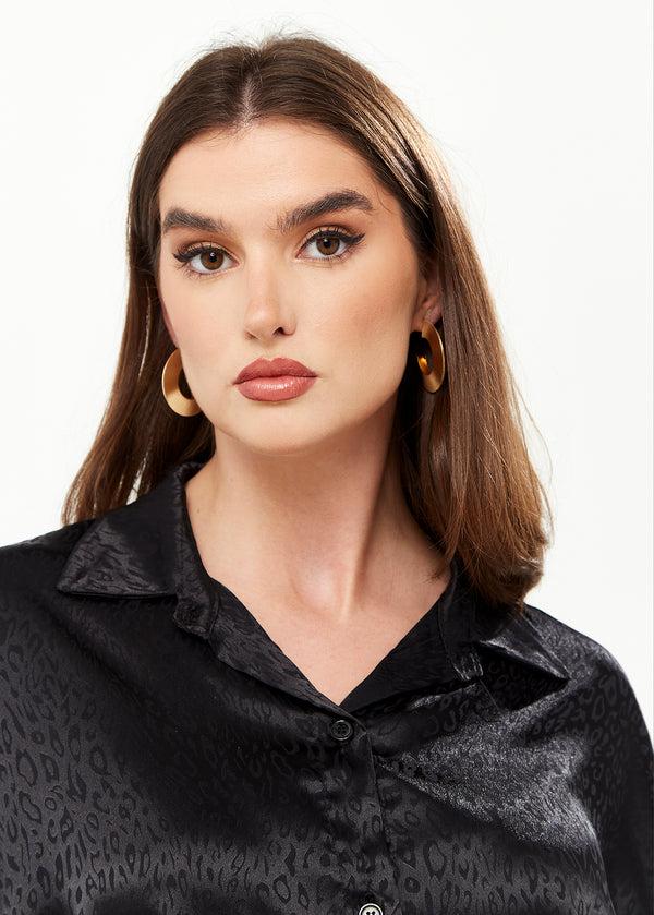 Liquorish Divine Grace Flattened Hoop Earrings In Gold