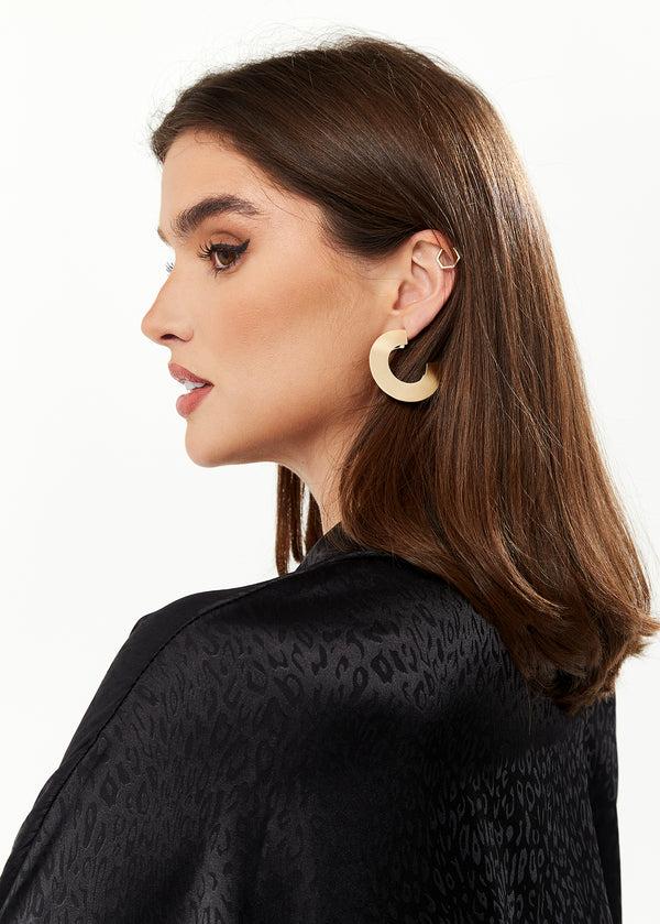 Liquorish Divine Grace Flattened Hoop Earrings in Gold Liquorish Divine Grace Flattened Hoop Earrings in Gold