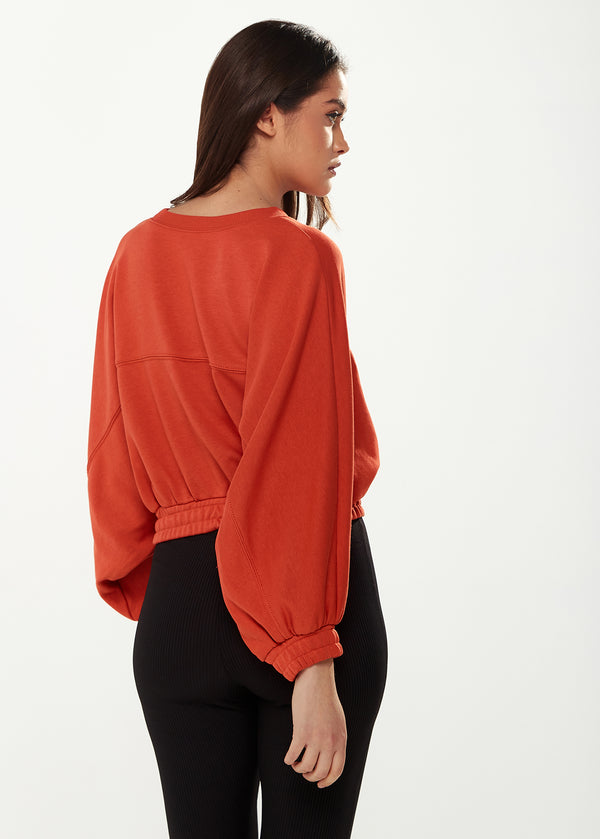 Liquorish Women's Cropped Sweatshirt In Dark Orange With Voluminous Bat And Balloon Sleeves Elastic Cuffs And A Chic Design