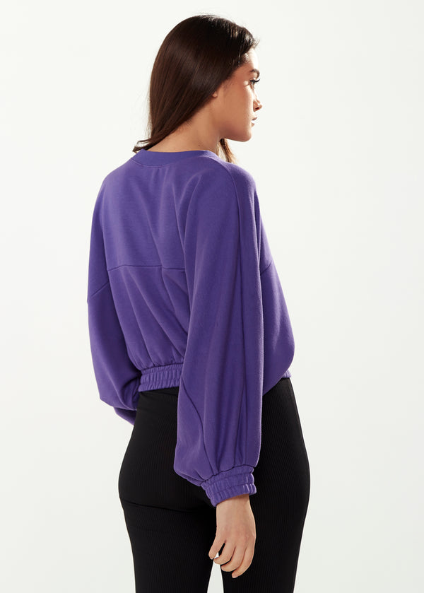 Liquorish Women's Cropped Sweatshirt In Purple With Unique Bat And Balloon Sleeves Round Neck And Elastic Cuffs For A Chic Look