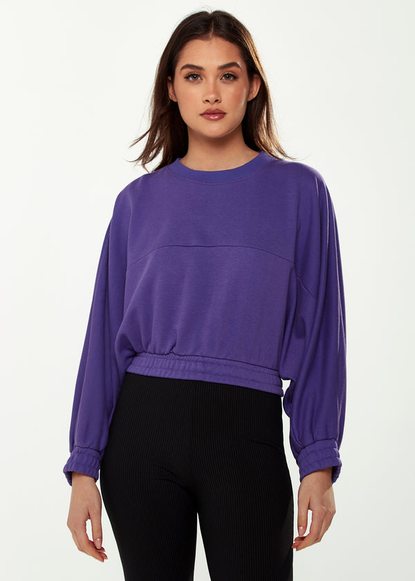 Liquorish Women's Cropped Sweatshirt in Purple with Unique Bat and Balloon Sleeves Round Neck and Elastic Cuffs for a Chic Look