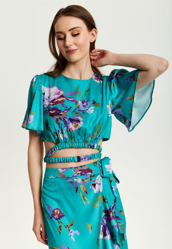 Liquorish Women's Green Floral Print Crop Top With Tie Waist Short Sleeves Crop Fit Model Wears UK 8/ EU 36/ US 4