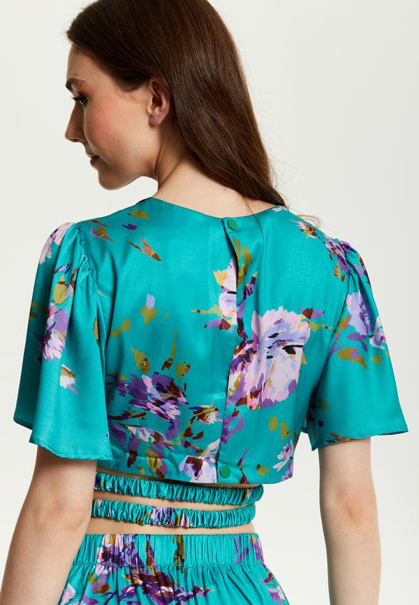 Liquorish Women's Green Floral Print Crop Top With Tie Waist Short Sleeves Crop Fit Model Wears UK 8/ EU 36/ US 4