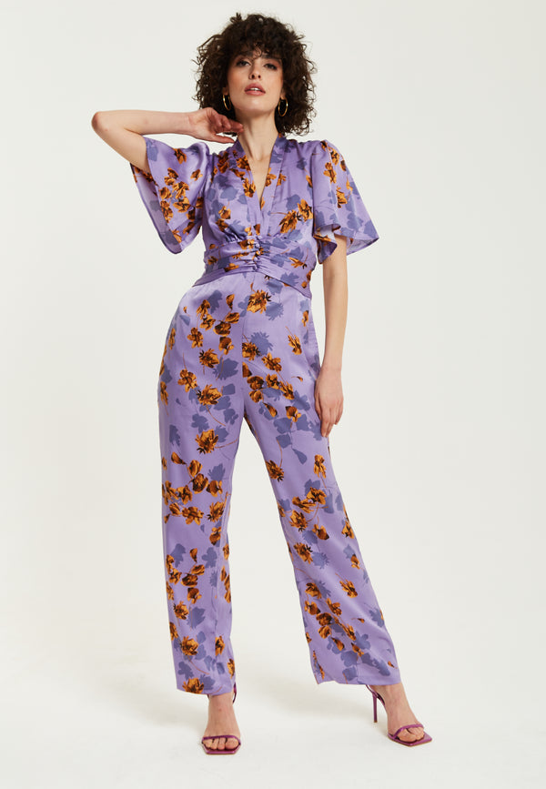 Liquorish Women's Jumpsuit - Purple Floral Wide Leg with Angel Sleeves and Front Buttons by Liquorish