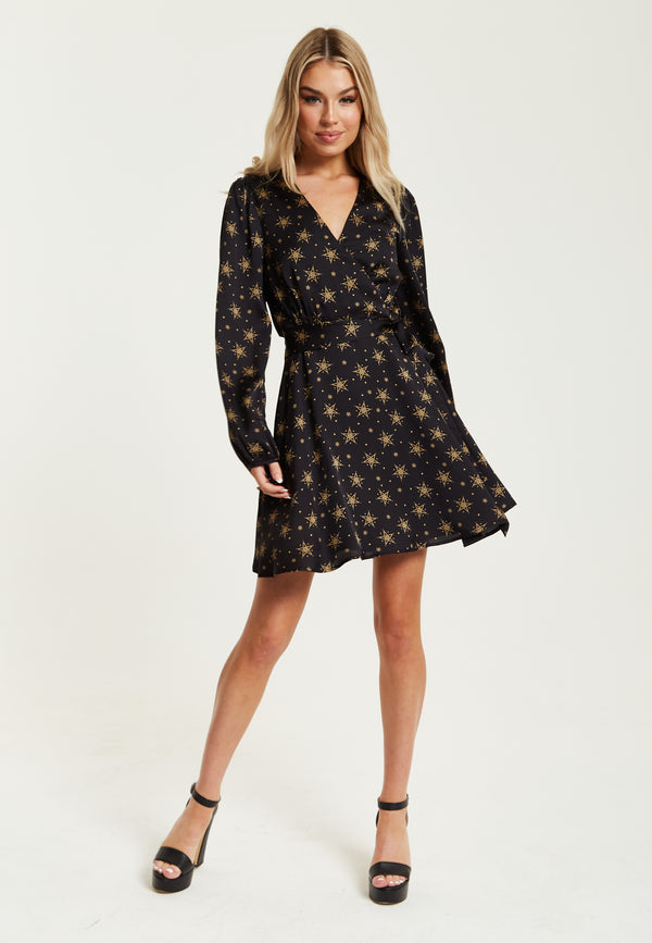 Liquorish Women's Mini Dress In Black With Long Sleeves Gold Star & Polka Dot Print Wrap Design - Liquorish