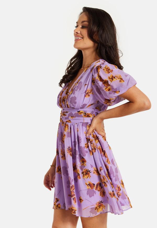 Liquorish Women's Mini Dress In Purple Floral With Short Sleeves And Deep V Neck - Stylish Button Waistband By Liquorish