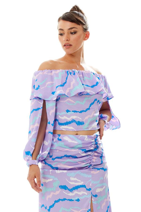 Liquorish Women's Ruffle Long Sleeve Off The Shoulder Top With Sleeve Slits in Lilac - Abstract Print Crop Fit