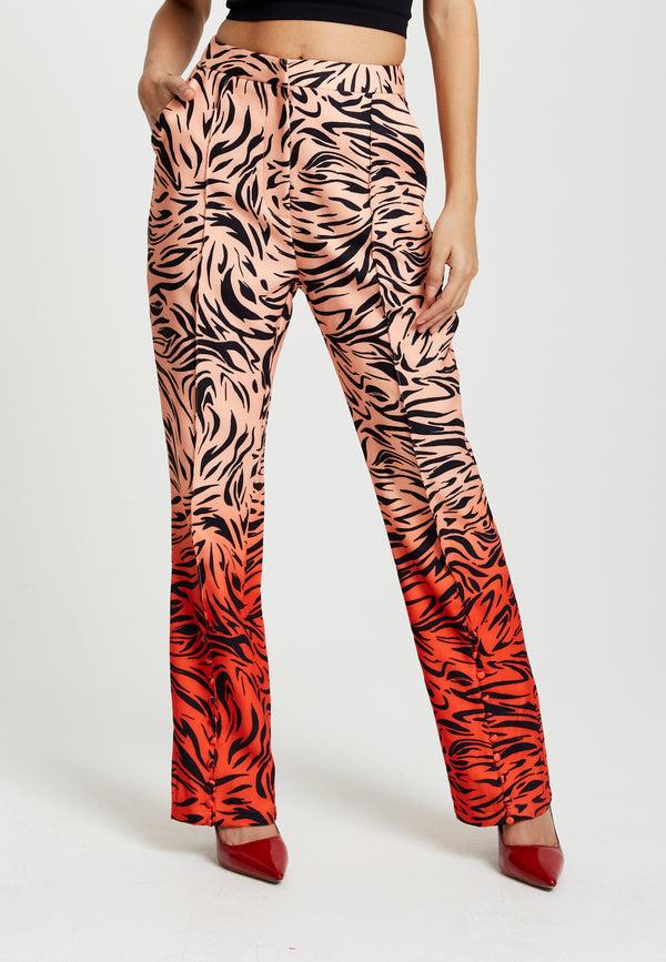Liquorish Women's Trousers in Orange and Nude Zebra Print with Slit Detail and Button Closure by Liquorish