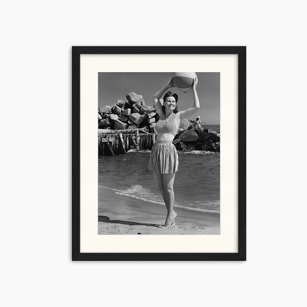 liv corday Woman holding ball on beach