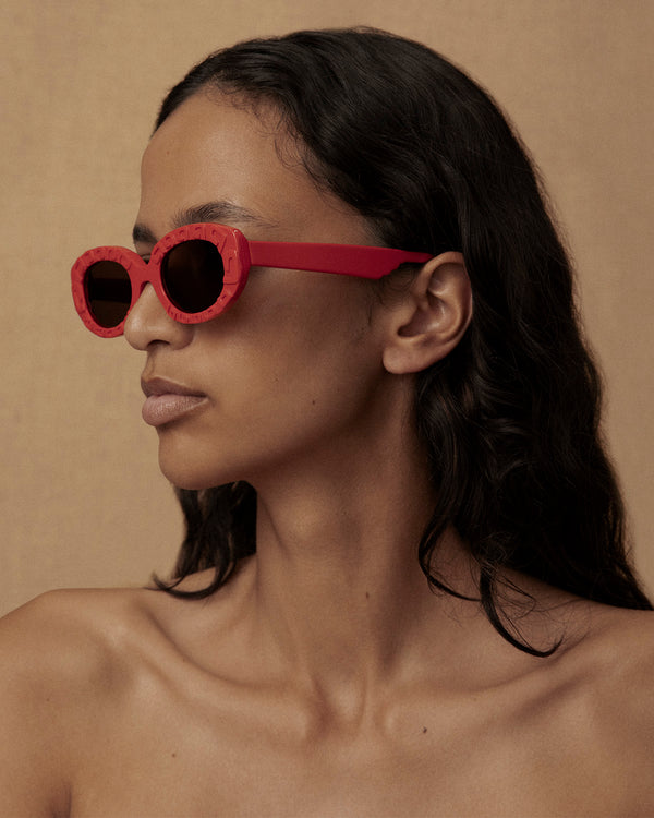 Lucy Folk Draa Embossed Oval Sunglasses