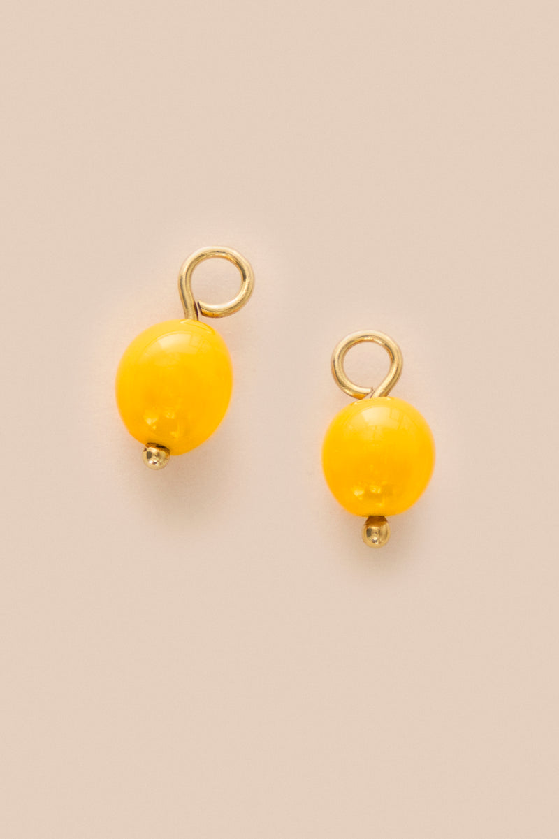 Lukhanyo Mdingi PAIR OF GLASS ARTISANAL BEADS - AMBER