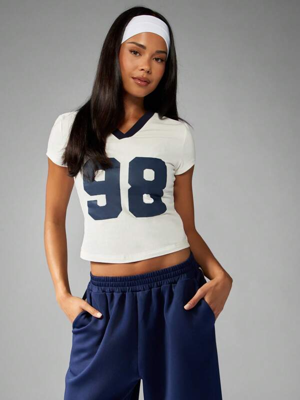 missguided MISSGUIDED Cropped V Neck Baby Tee With Varsity Number