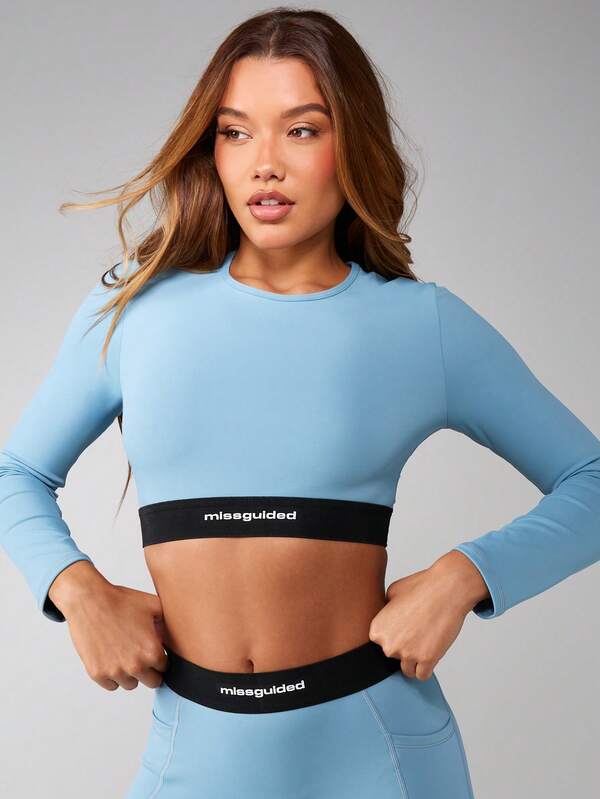 missguided MISSGUIDED Long Sleeve Cropped Top With Logo Waistband