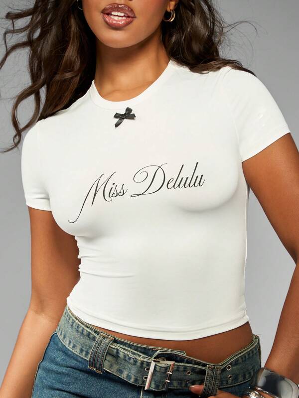 missguided MISSGUIDED Miss Delulu Script Print Short Sleeve Form Fitting Crop T-Shirt With Bow