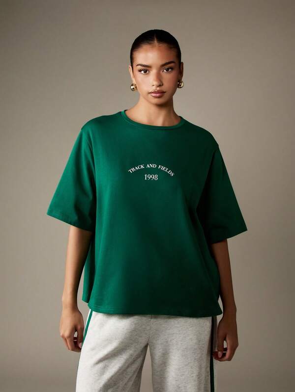missguided MISSGUIDED Oversized T Shirt With Retro Track Text Print