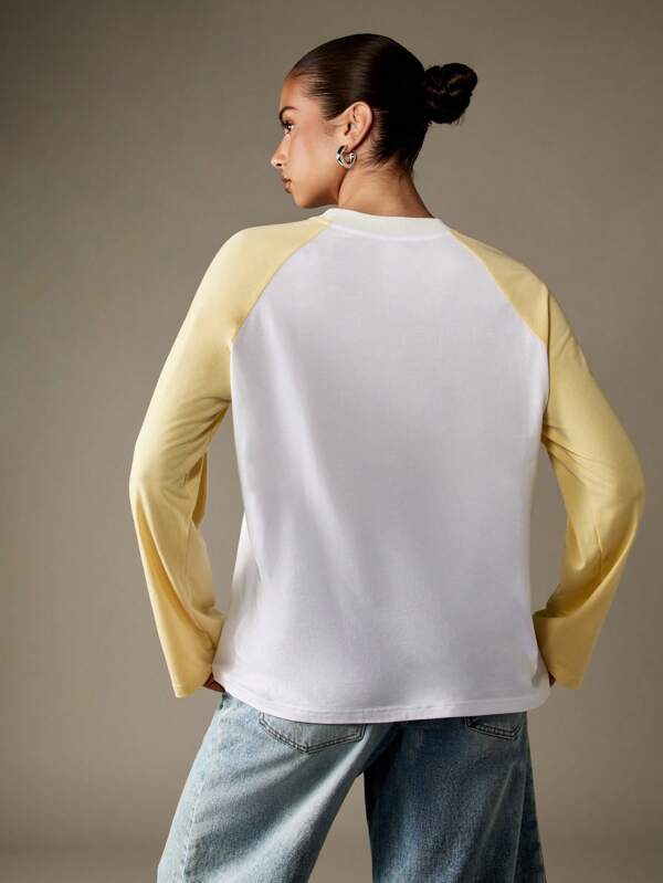 Missguided MISSGUIDED Varsity NYC Graphic Long Sleeve Raglan T-Shirt With Crewneck