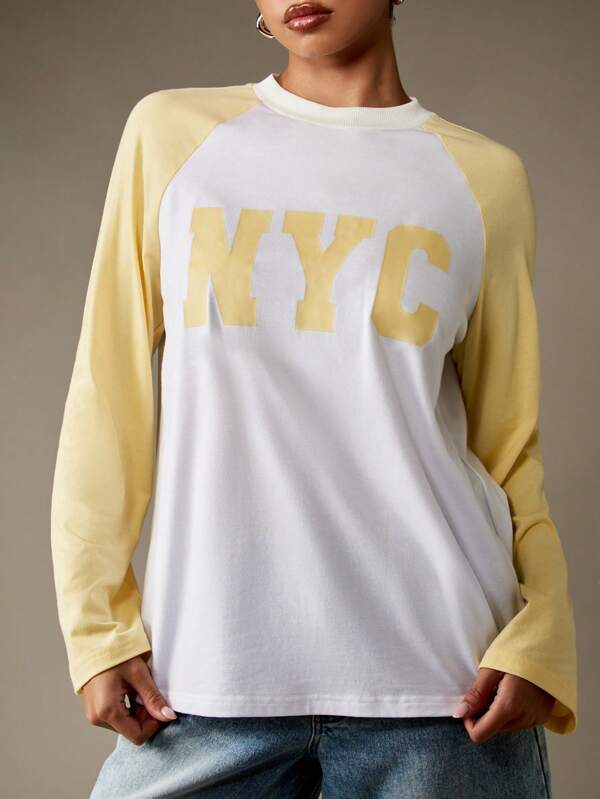 missguided MISSGUIDED Varsity NYC Graphic Long Sleeve Raglan T-Shirt With Crewneck